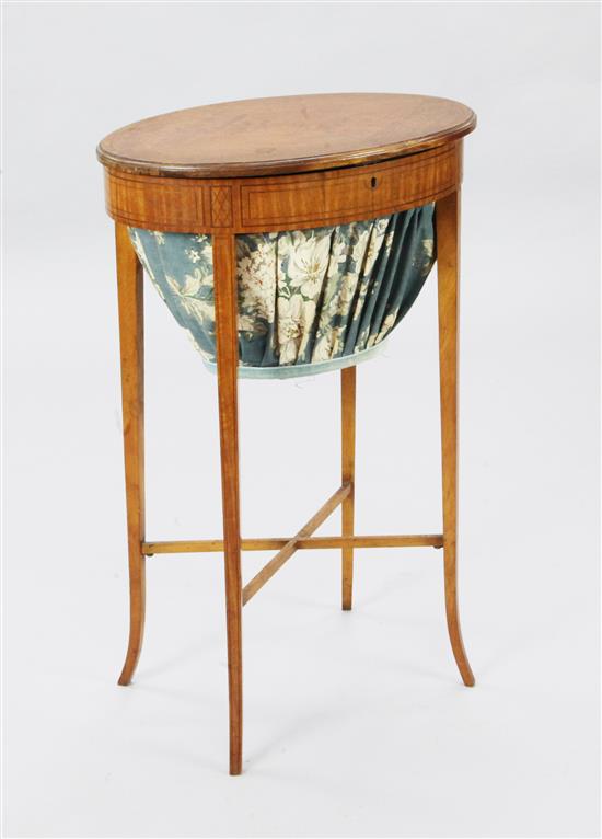 An Edwardian inlaid satinwood work table, W.1ft 7in. D.1ft 2in. H.2ft 5in.